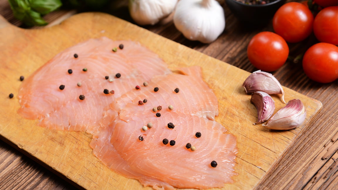 lean raw fish on cutting board