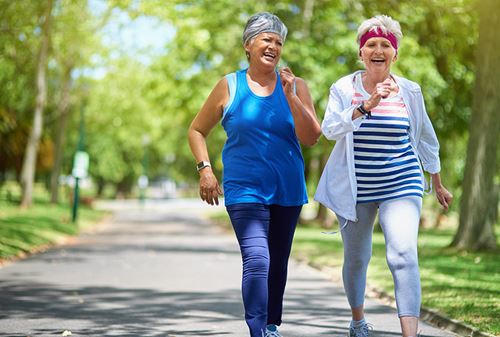 Older women walking in park