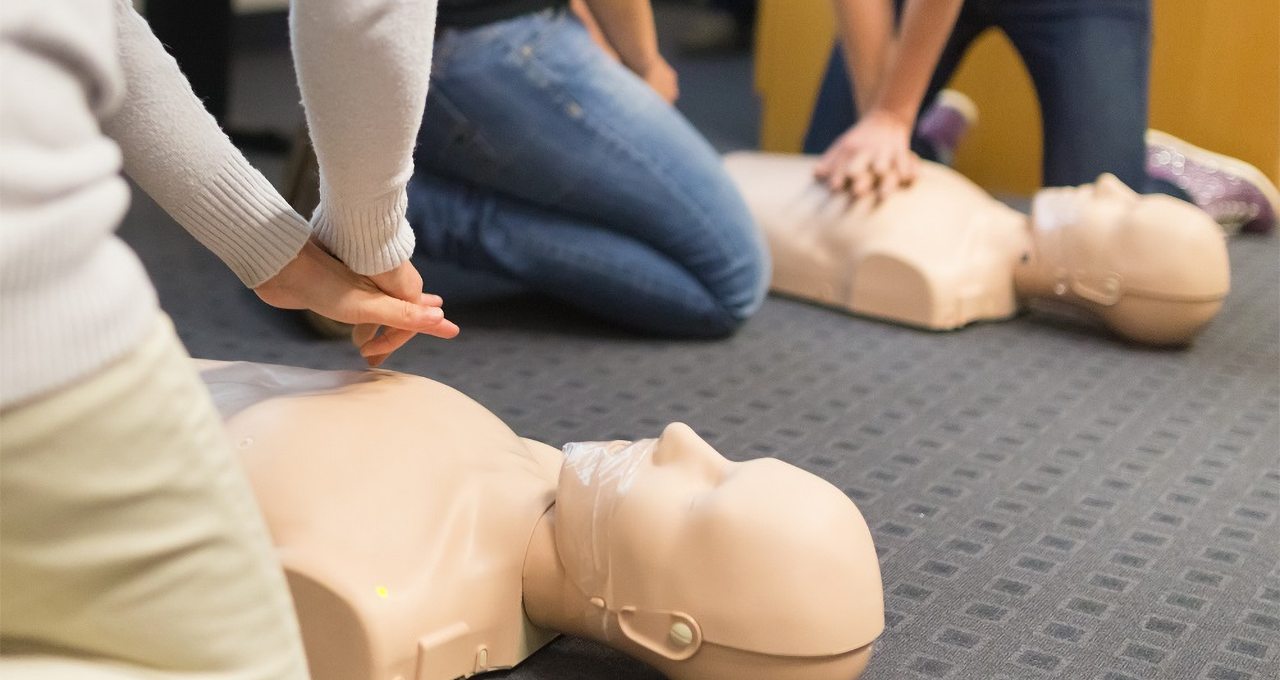 group CPR training with manikins