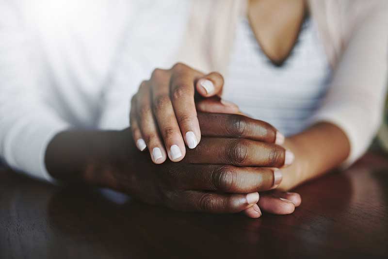 close-up of couple holding hands