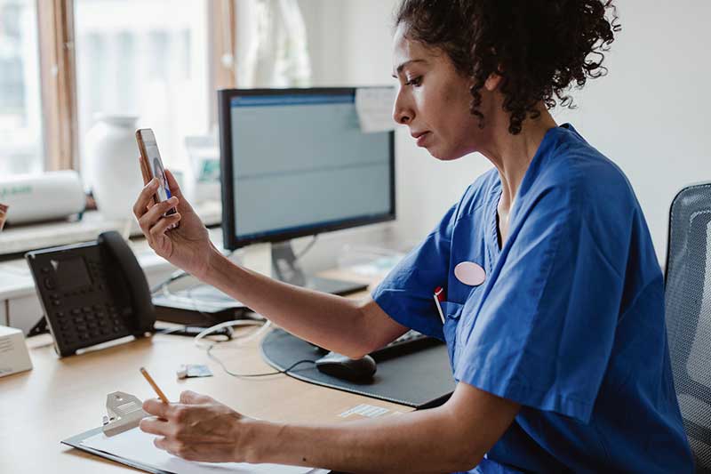 doctor asking telemedicine questions in office