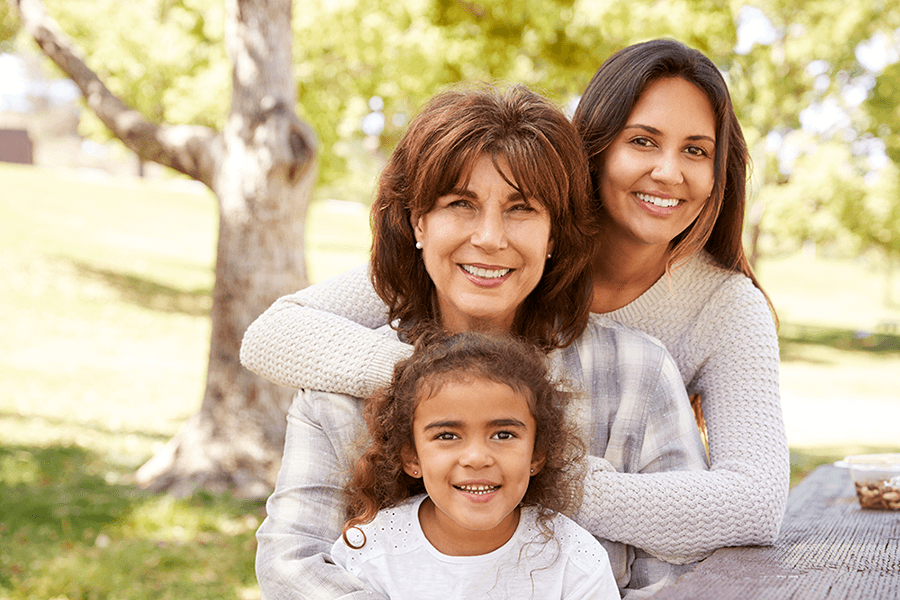 three generations of women at a family picnic