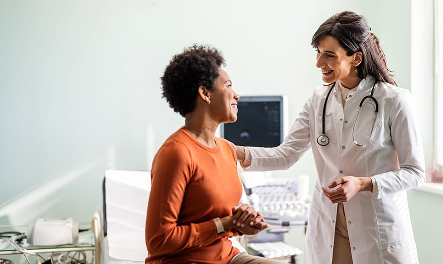 Female doctor talking with female patient
