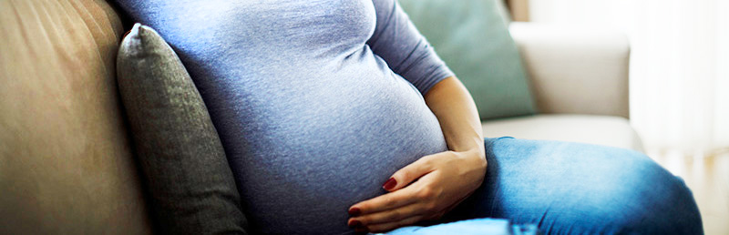 pregnant woman relaxes on couch pregnant woman relaxes on couch