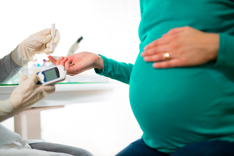 Pregnant Woman Having Blood Glucose Checked