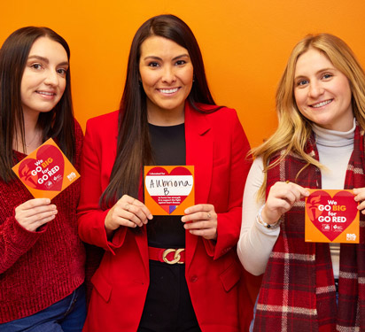 Big Lots Associates holding Go Big for Go Red hearts