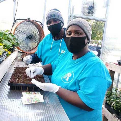 Hatcher Station Charles and Anzinett planting seedlings