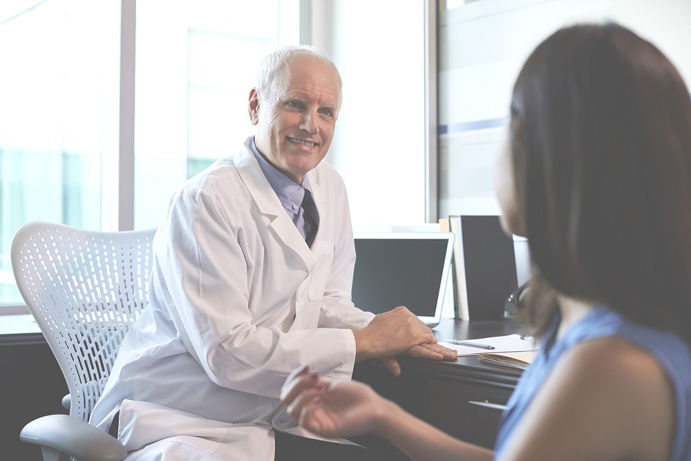 Doctor consulting with female patient