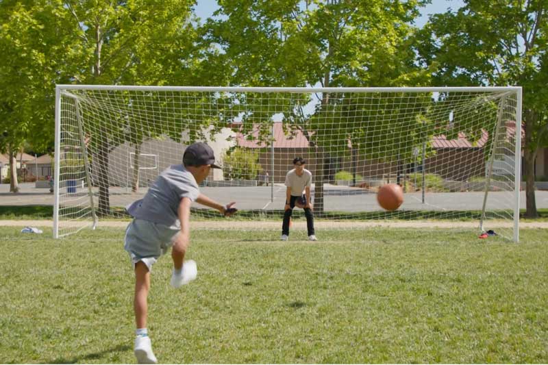 Luke kicking a soccer ball