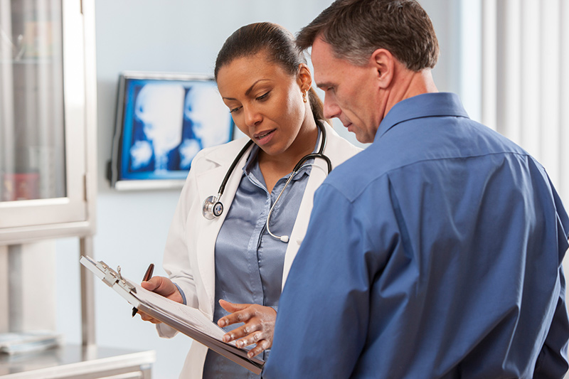 man talking to woman doctor