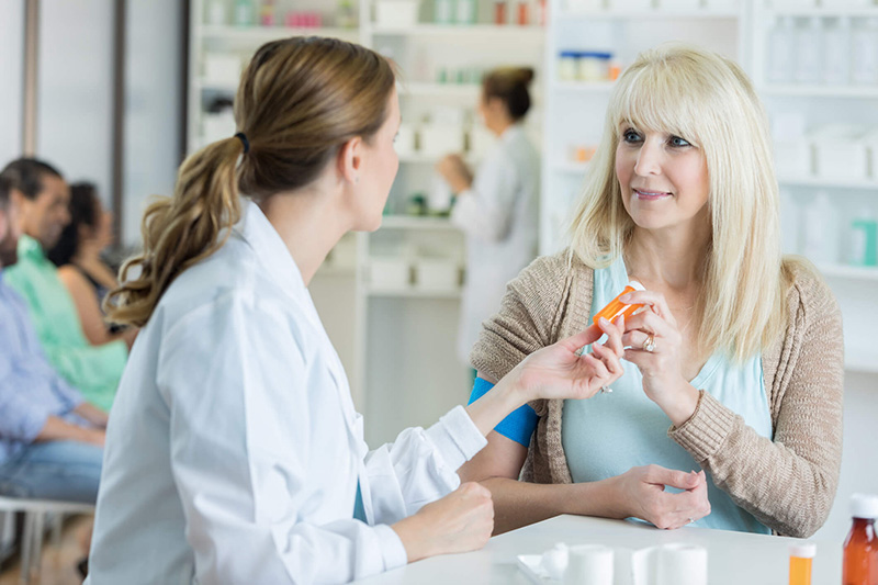 woman talking to pharmacist