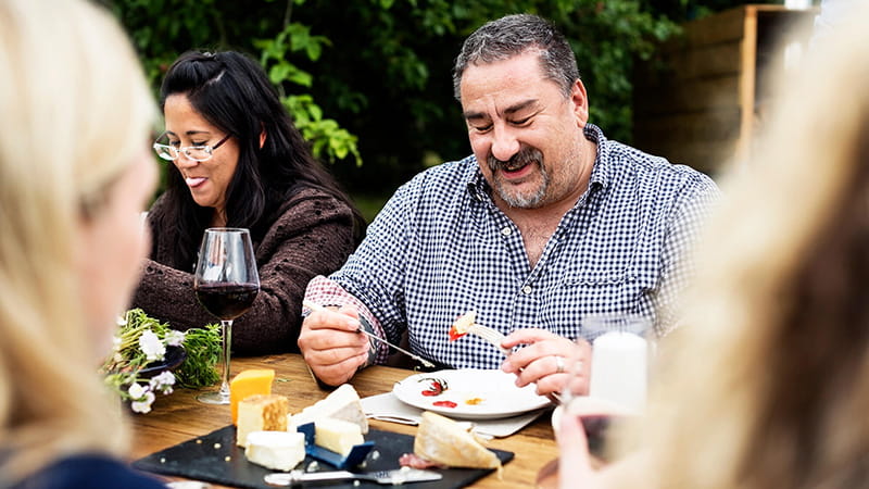 adults dining outdoors