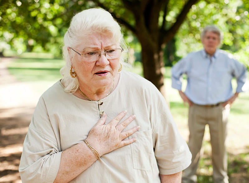 senior woman with chest pain