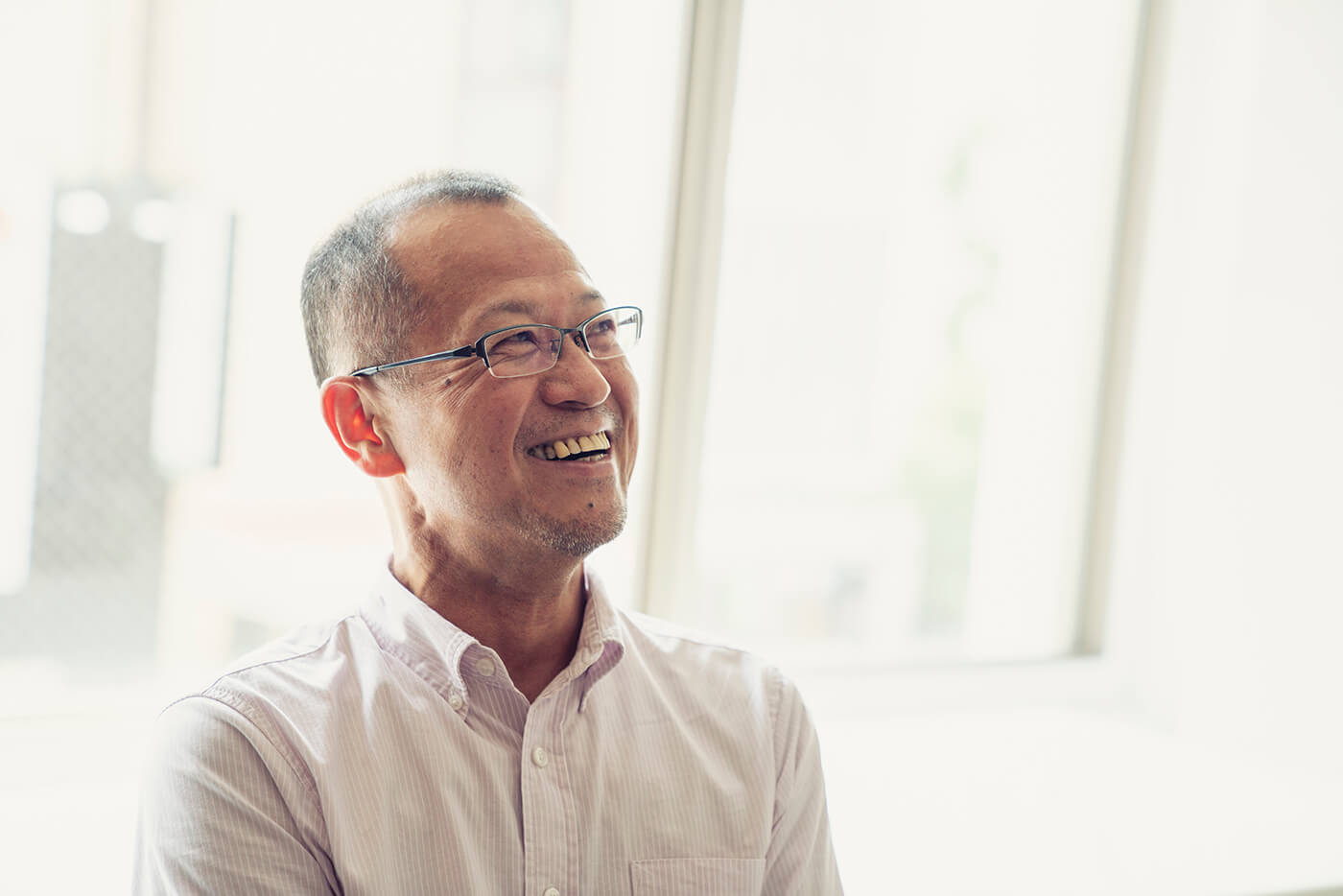 older asian man smiling laughing