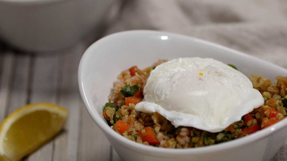 Poached Eggs with Pesto Bulgur in a bowl