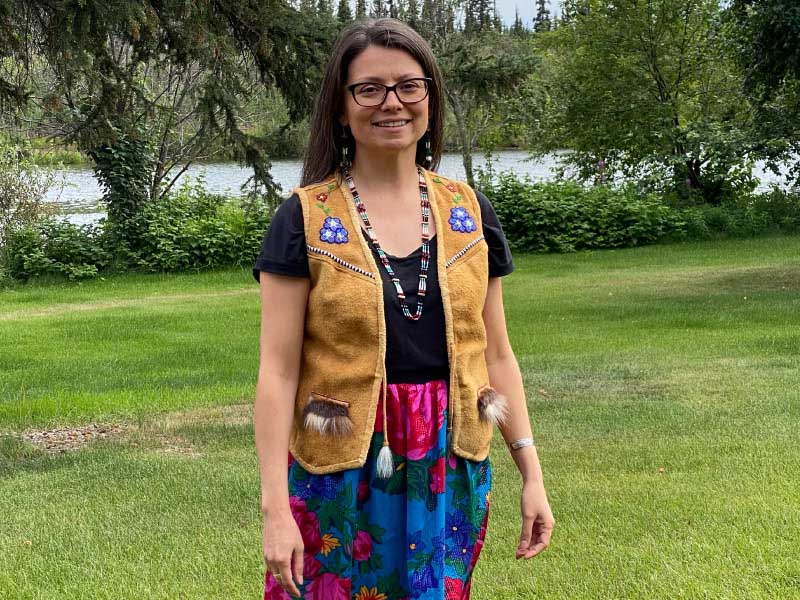 Dr. Allison Kelliher, wearing a moose hide vest gifted to her by her family, uses her training to promote better cardiovascular health for American Indian and Alaska Native women. (Photo courtesy of Dr. Allison Kelliher)