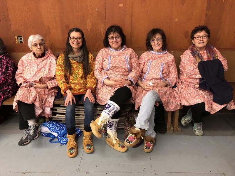 Dr. Allison Kelliher with her family at the tribal hall in the village of Nulato, Alaska, for a memorial potlatch called the Stick Dance. From left: her aunt Eleanor Laughlin; Kelliher; cousin Shannon Erhart; aunt Miranda Wright; and aunt Ida Hildebrand. (Photo courtesy of Dr. Allison Kelliher)