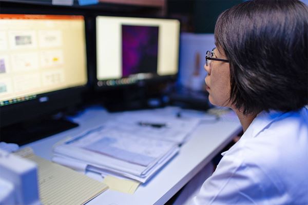 female researcher at computer