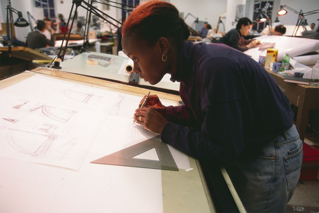 Woman working on a drawing board