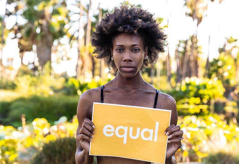 Woman holding Equal sign