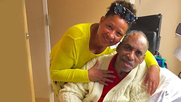 Loretta Sharp Gray is posing with her arm around her life partner, Paul Smith. Loretta Sharp Gray is posing with her arm around her life partner, Paul Smith.