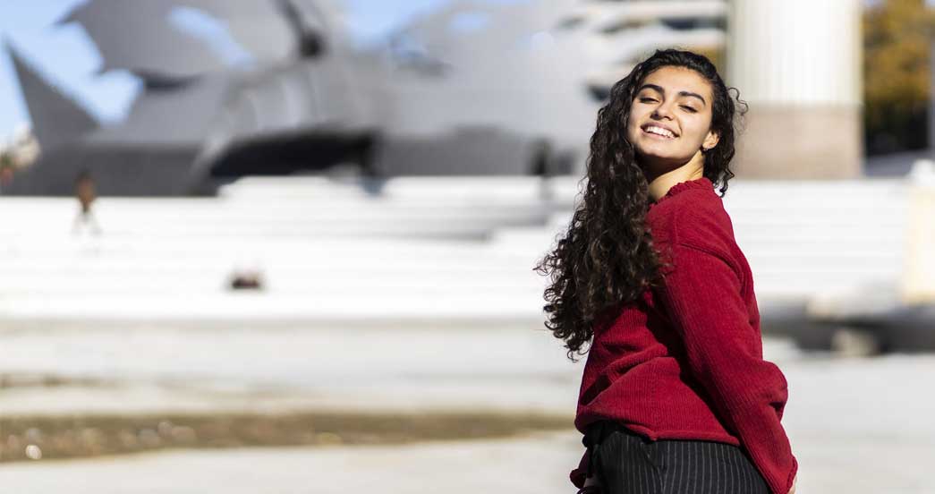Hispanic young woman smiling outdoors Hispanic young woman smiling outdoors