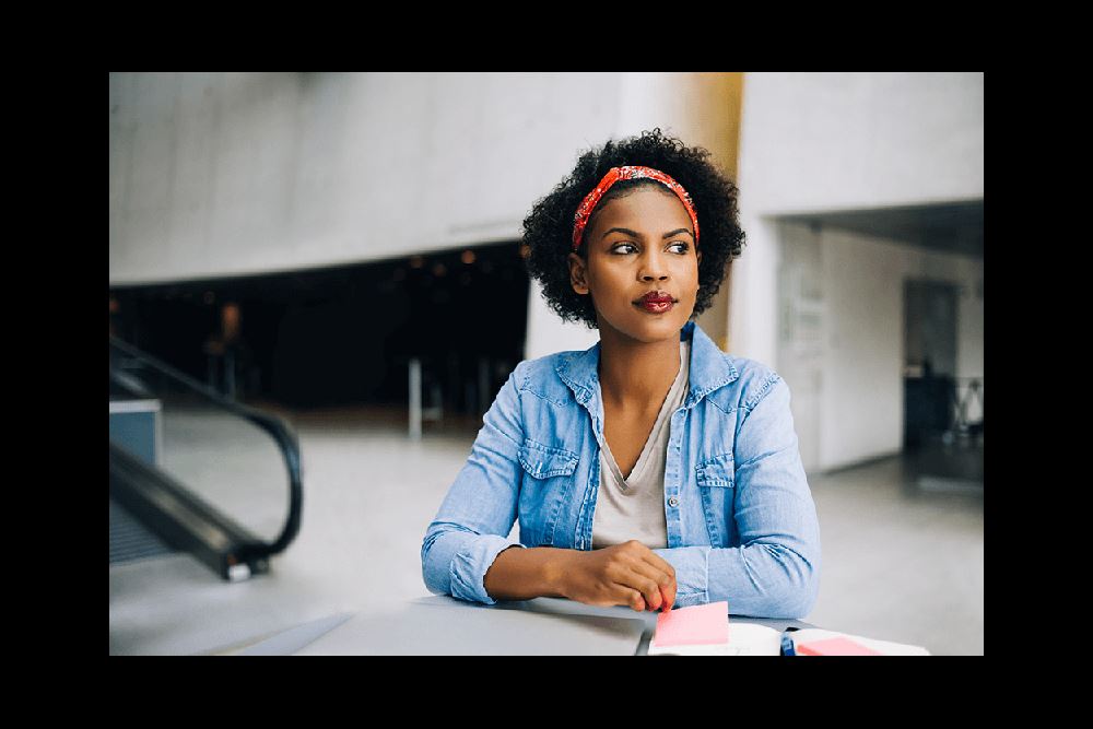 young female entrepreneur thinking
