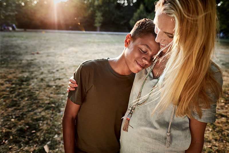 Mom hugging Son at sunset Mom hugging Son at sunset