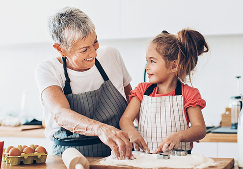 Grandmother and child bake in kitchen Grandmother and child bake in kitchen