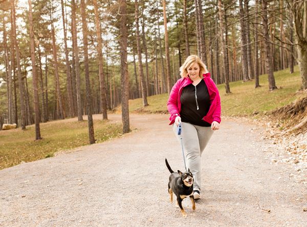 woman exercising with dog woman exercising with dog