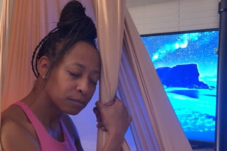 Go Red for Women Class of Survivors member Kenya Robinson doing bedtime stretches 