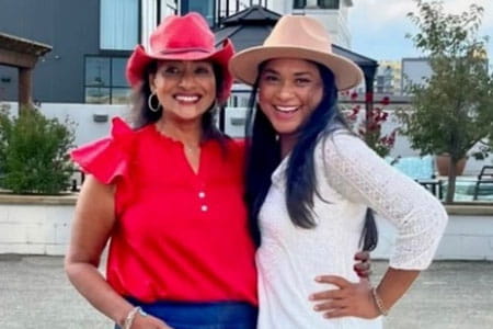 Two Women Wearing Hats Smiling Outdoors