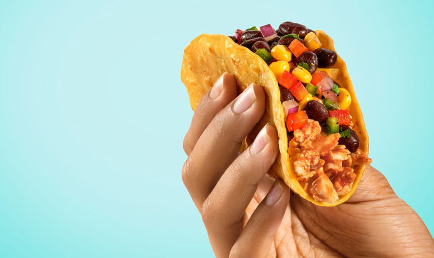 hand holding a taco