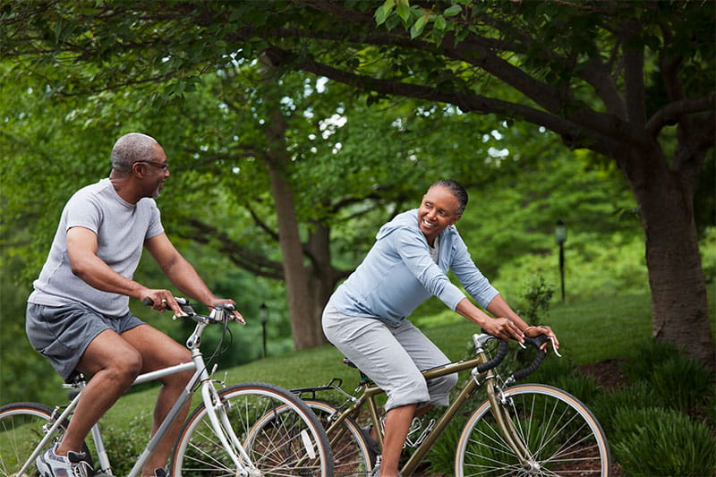 Black couple riding bicycles
