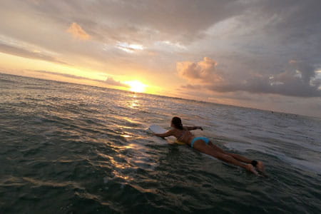 Go Red for Women Class of Survivors member Melissa Ziebell surfing