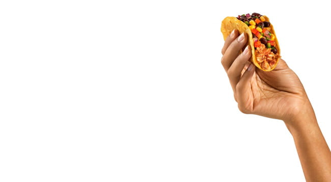 hand only holding a taco on a white background
