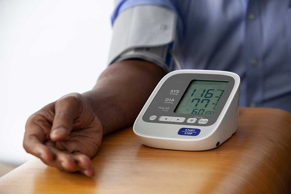 closeup of male arm taking blood pressure