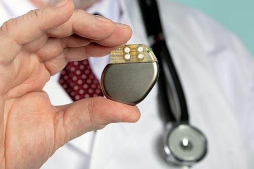 hand holding pacemaker